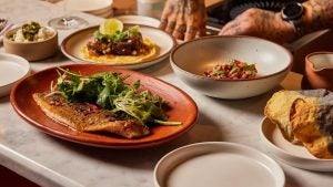 plates of food with chef at the back